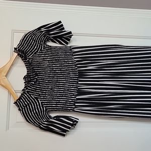 Off the shoulder, stretchy top and flowy bottom.  Super cute and comfy!